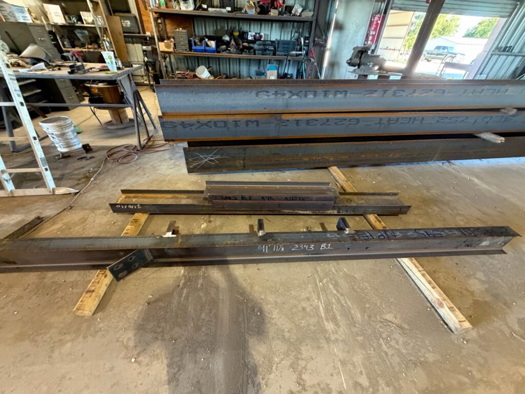 Structural steel beams piece marked for fabrication at Heartland Steel in Woodway, TX