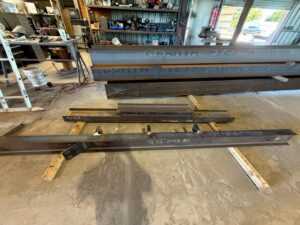 Structural steel beams piece marked for fabrication at Heartland Steel in Woodway, TX